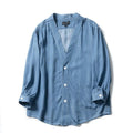 Men's dark blue denim coat with three-quarter sleeves and V-neck collar showing front pocket detail