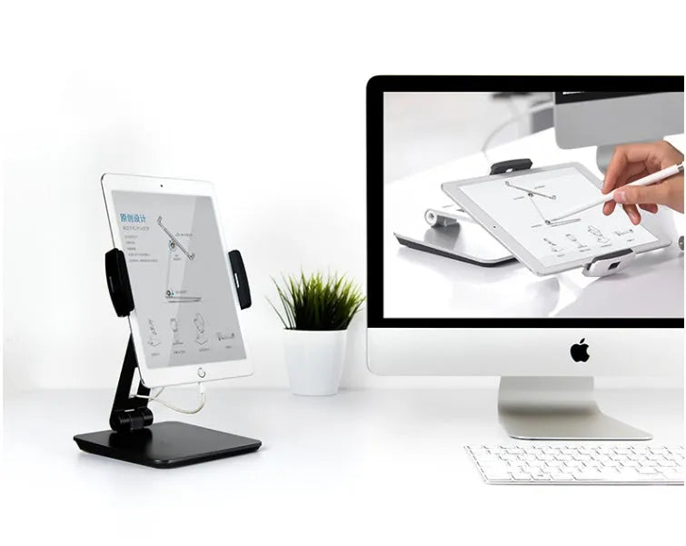 Folding aluminium phone and tablet stand in silver, shown holding a tablet at an angle.
