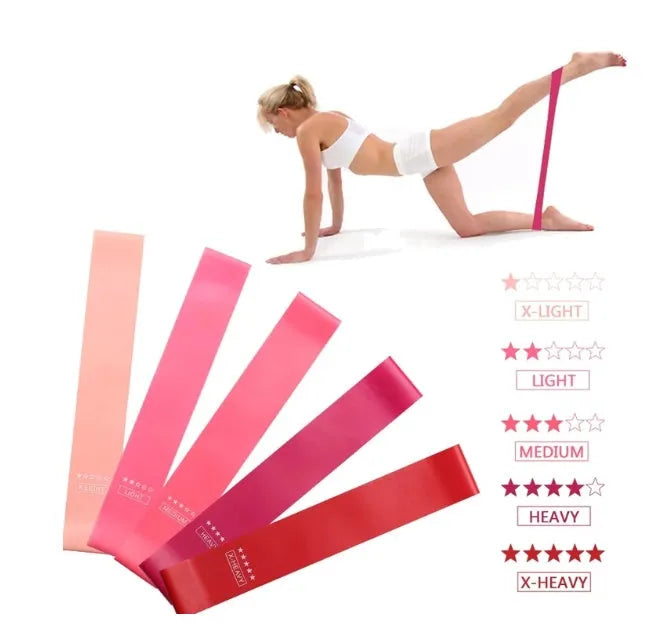 Five pink gradient latex yoga tension bands with varying thickness for resistance training