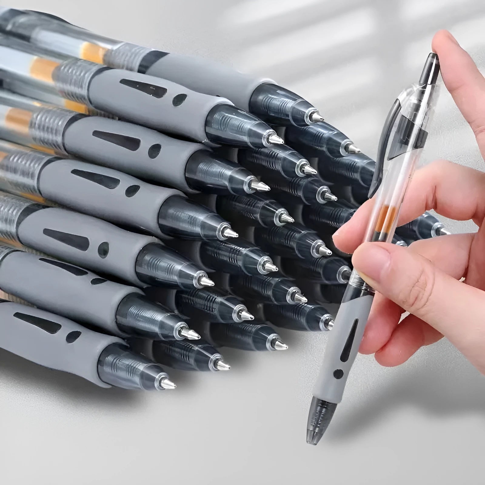 A single 0.5mm tip gel pen in a neutral colour, showing black, blue, and red ink options.