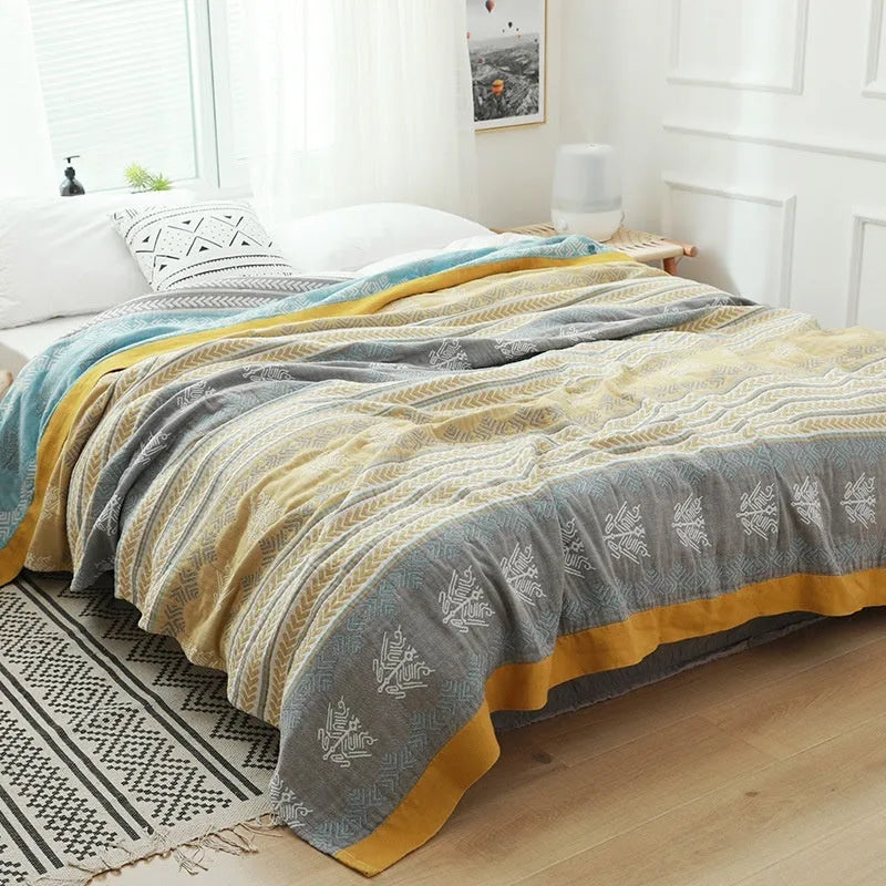 Five-layer thickened pure cotton gauze bed blanket in Roulette Wheel Blue pattern on bed