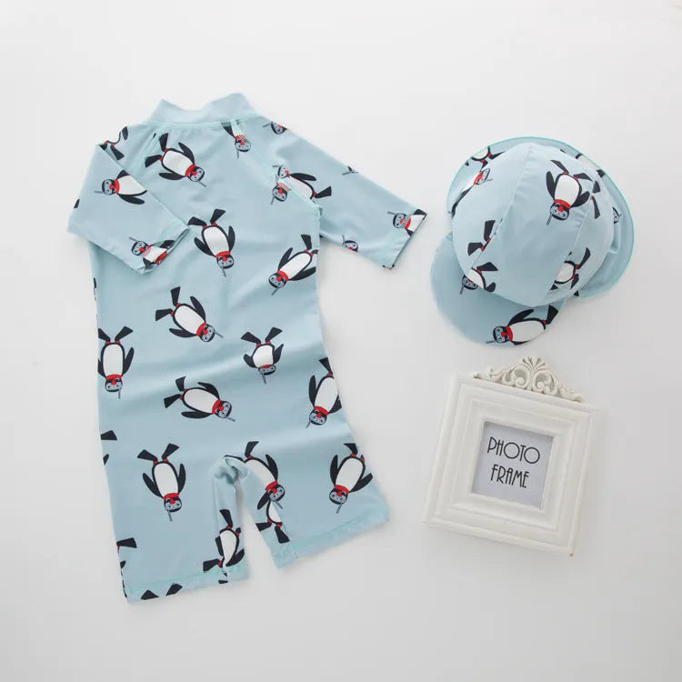 Boys' blue penguin print swim set with long sleeve swimsuit and matching swimming cap