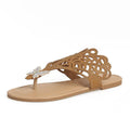 Women's black flip-toe sandals with rhinestone decoration showing slip-on hollow design