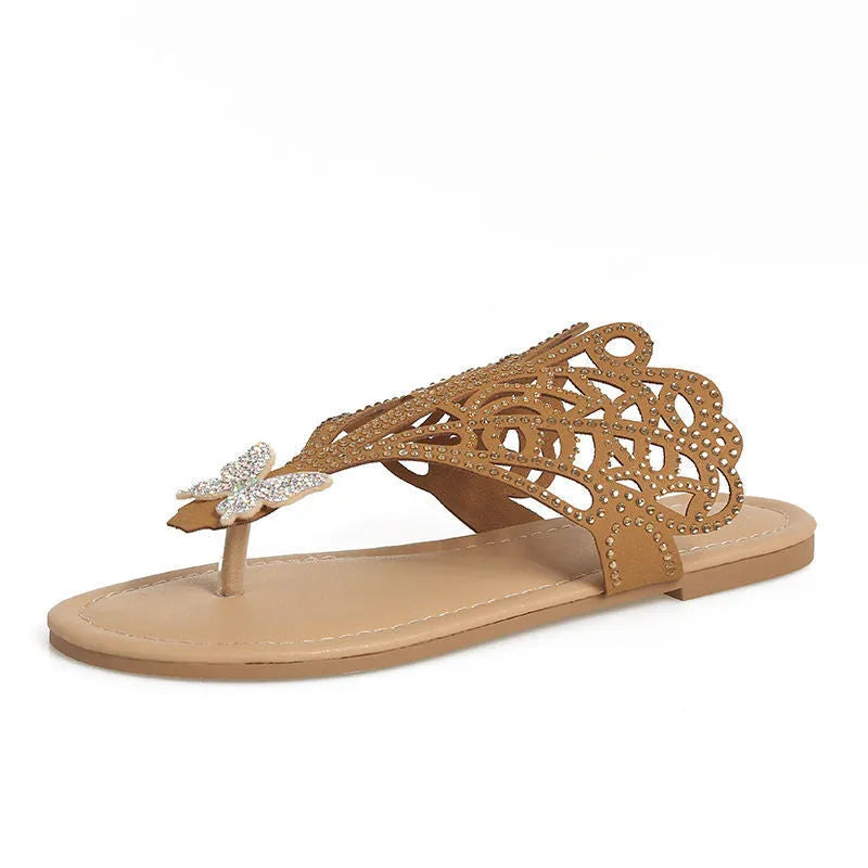 Women's black flip-toe sandals with rhinestone decoration showing slip-on hollow design
