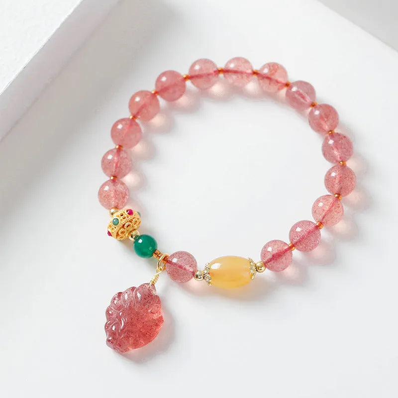 Women's crystal bracelet with strawberry quartz beads and nine tail fox charm
