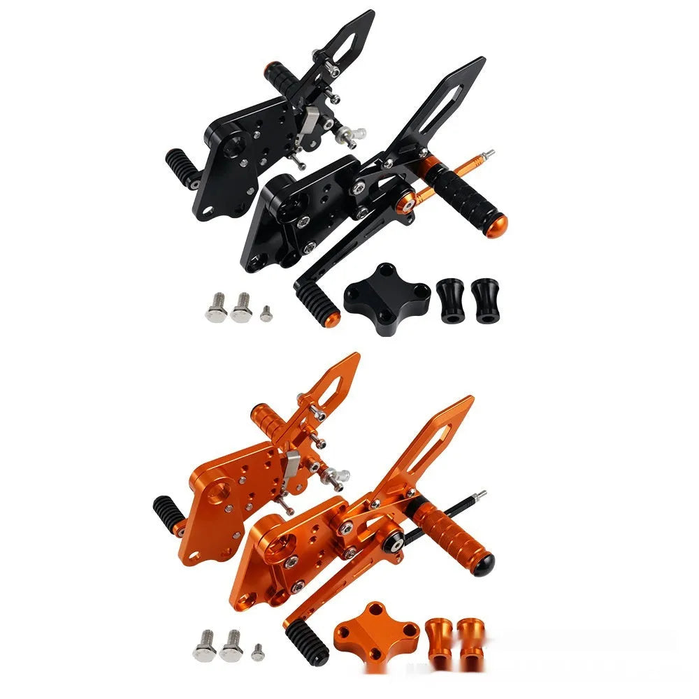 Black and orange KTM Duke motorcycle pedal support bracket assembly