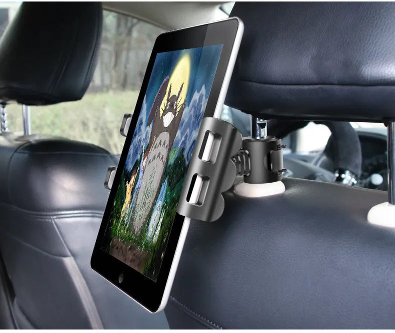 Black car headrest mount holding a tablet on the back seat, showing adjustable arm and universal bracket.
