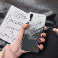 Black painted polycarbonate back cover case for a Huawei smartphone on a white background.