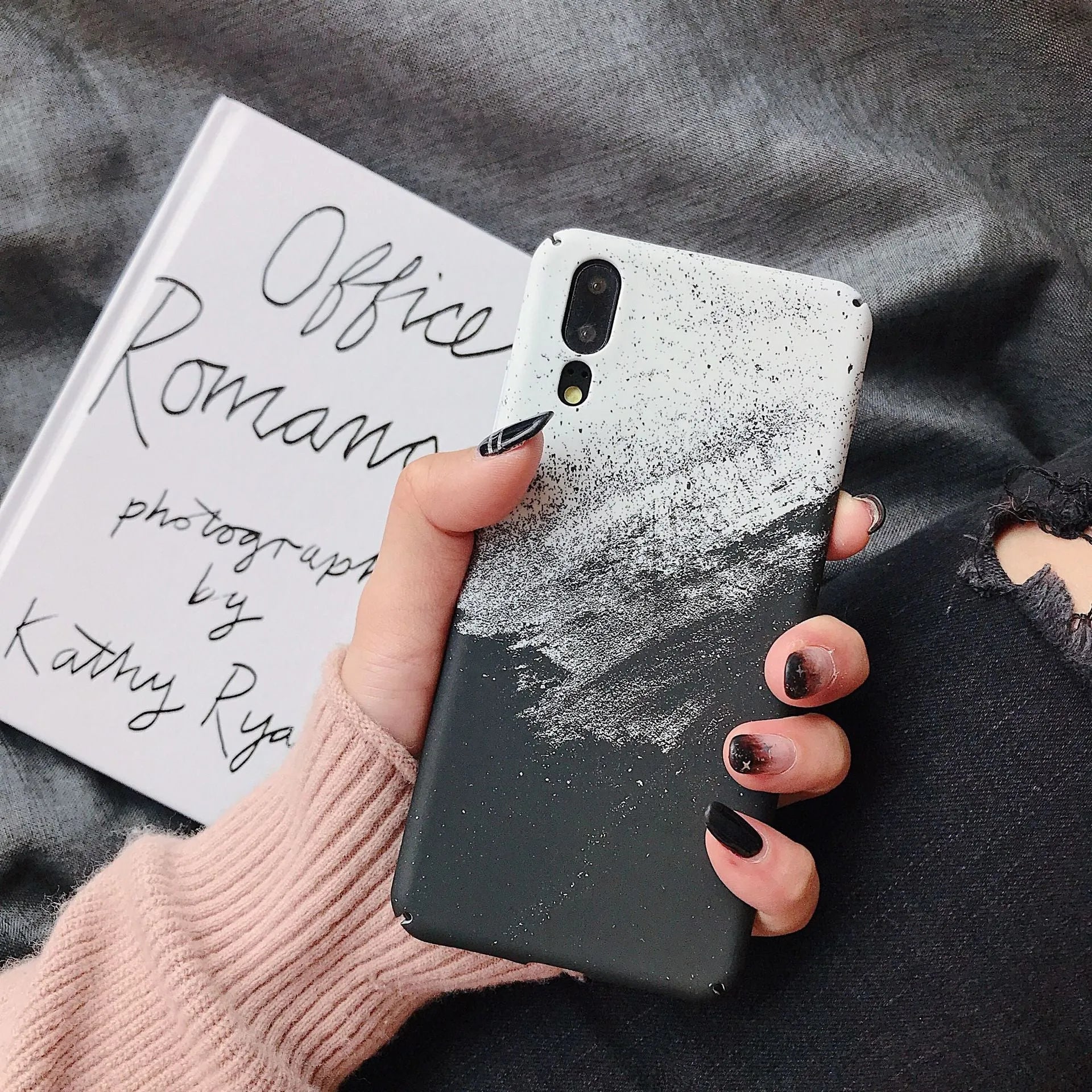 Black painted polycarbonate back cover case for a Huawei smartphone on a white background.