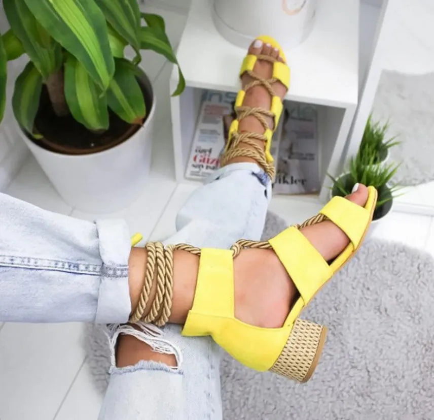 Women's beige suede sandals with a round head, thick middle heel, fish mouth toe, and front ankle straps.