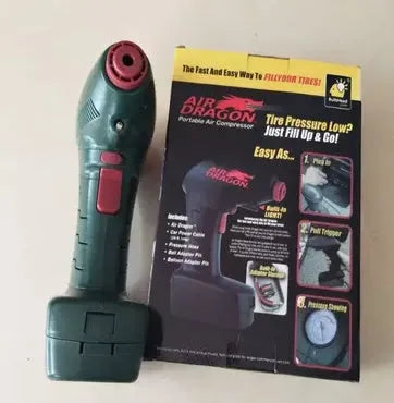 Black handheld portable 12V car tyre pump with digital display and LED light on inflation hose