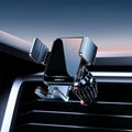 Black car air vent wireless phone charging bracket with automatic arms, shown with a mobile phone.