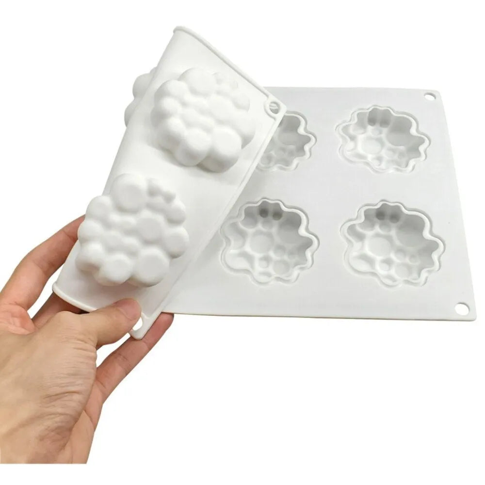 Round silicone baking mould with eight raised bubble cavities for tower cakes.