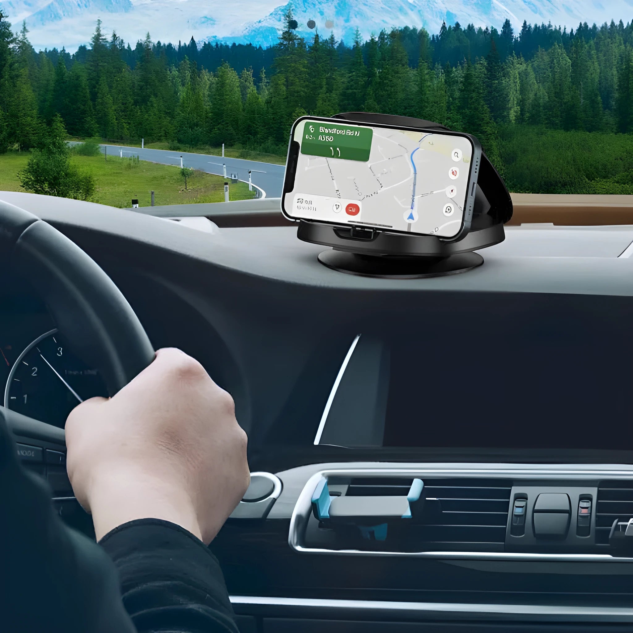 Black rotating suction cup car phone holder mounted on windscreen with smartphone in cradle