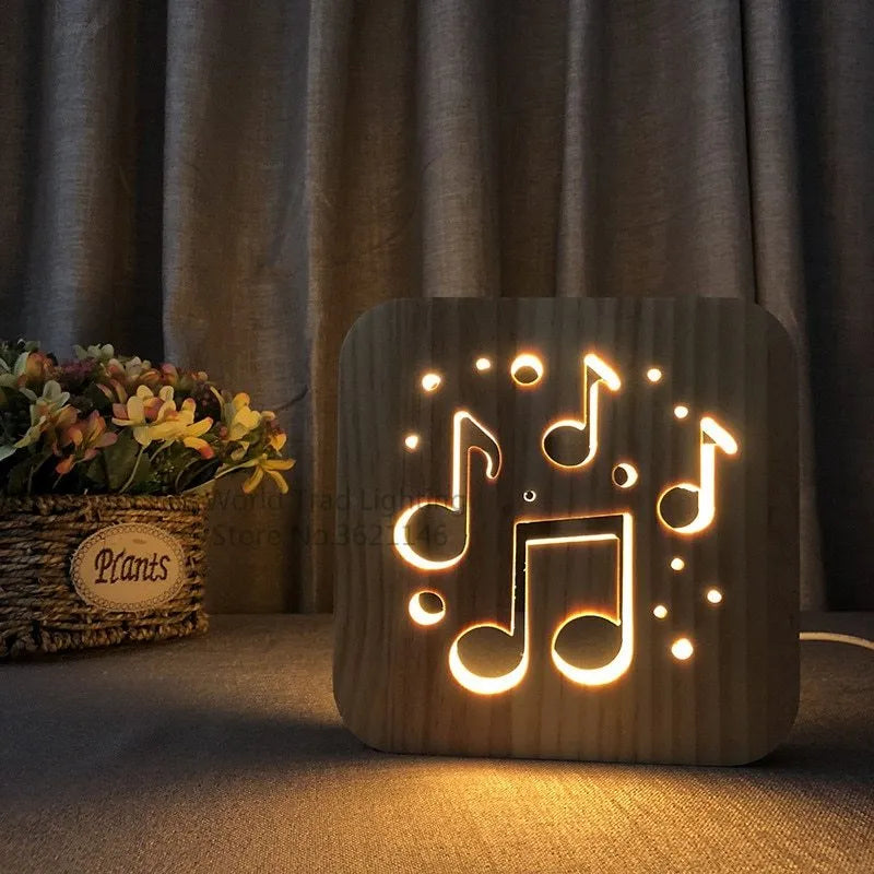 Natural pine wood cube LED atmosphere lamp with warm white glow on a desk.