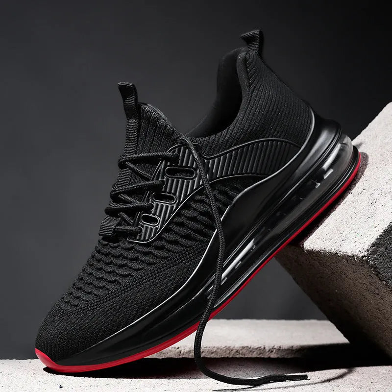 Men's black mesh running shoes with lace-up front and rubber sole on a white background
