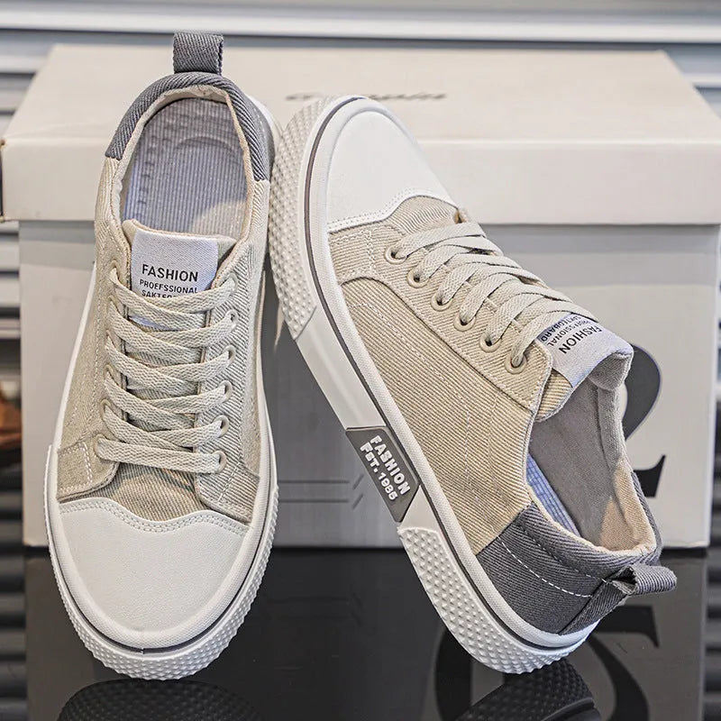 Men's low-top canvas casual shoe in blue with round toe, lace-up front, and soft PVC sole.