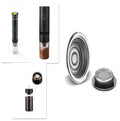Portable electric espresso machine in grey with USB charging cable, shown next to coffee capsules