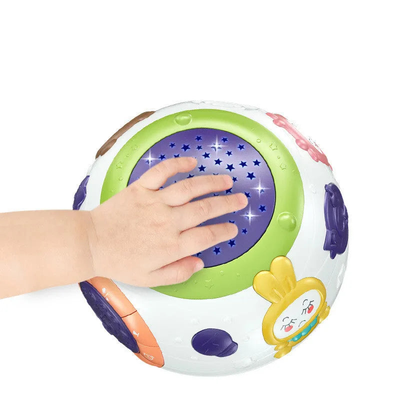White starry sky night light projector for children on a table, showing colourful light projection.