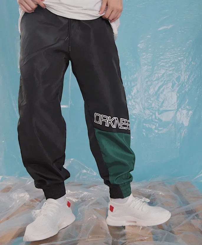 Japanese hip hop trousers with hit colour stitching, letter print, and bouquet foot detail in green low-waist drawstring style