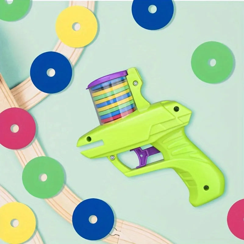 Green interactive cat toy launcher with foam disc on flat indoor surface.