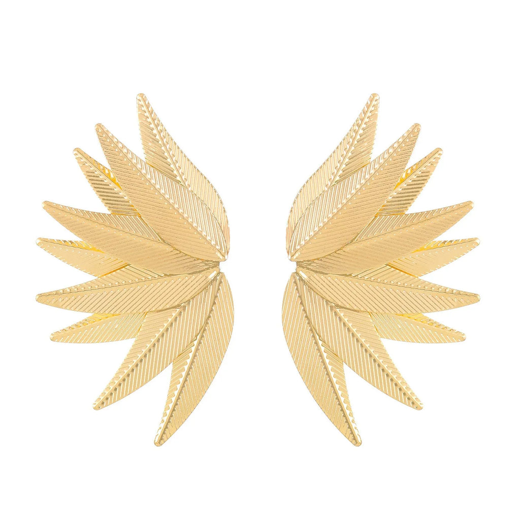 A pair of gold and white alloy patch earrings shaped like leaves.