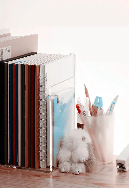 Transparent acrylic bookshelf displaying books with smooth polished edges