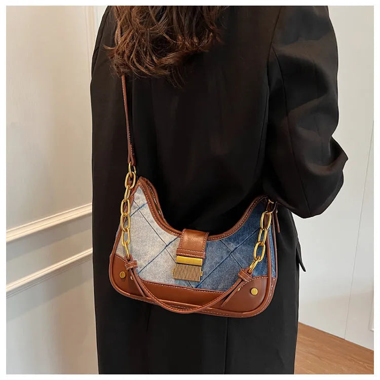 Brown denim women's bucket shoulder bag with diamond mesh, chain detail, and double straps.