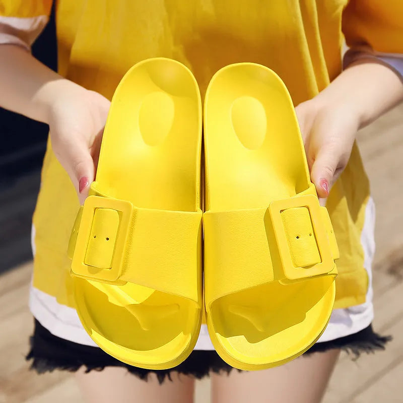 Women's grey blue EVA buckle slipper sandals on a white background.