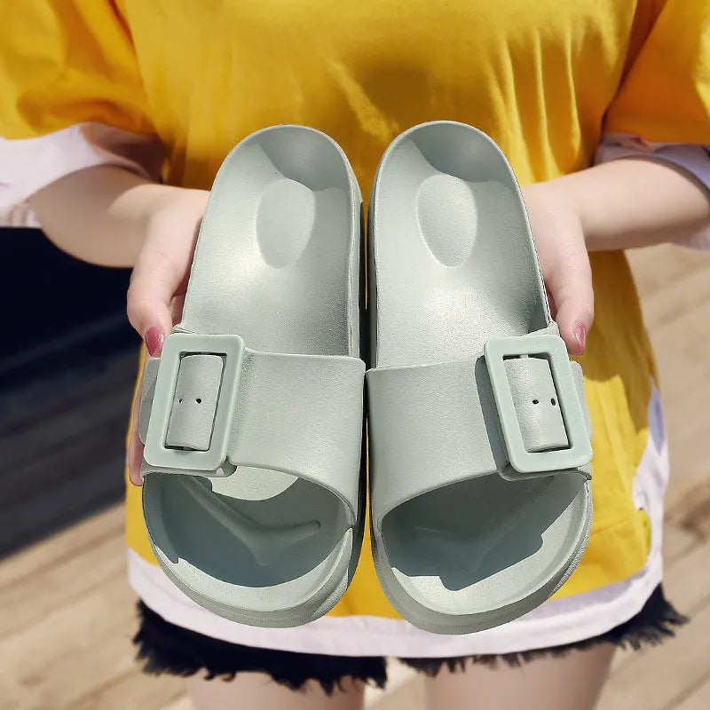Women's grey blue EVA buckle slipper sandals on a white background.