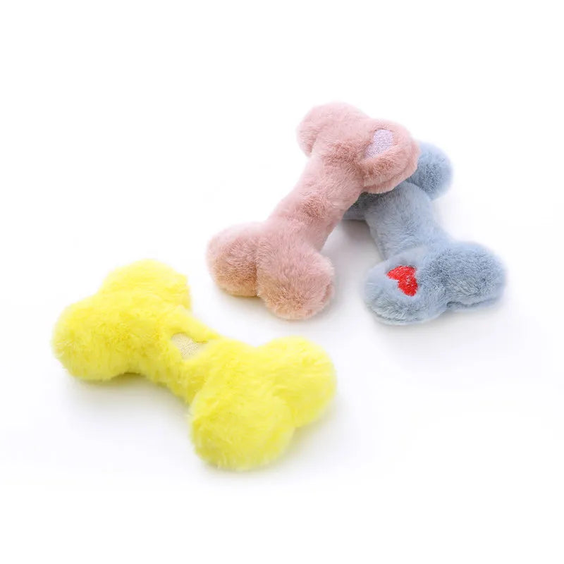 Blue squeaky plush love bone dog toy on a white background