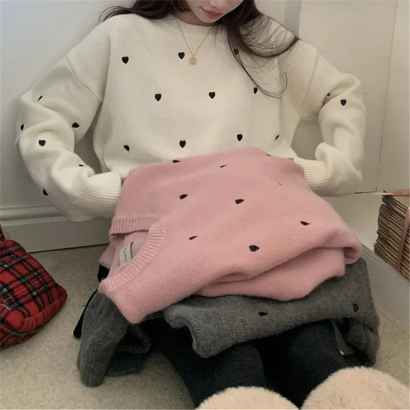 Loose beige women's pullover sweater with crew neck, long sleeves, and chest embroidery.