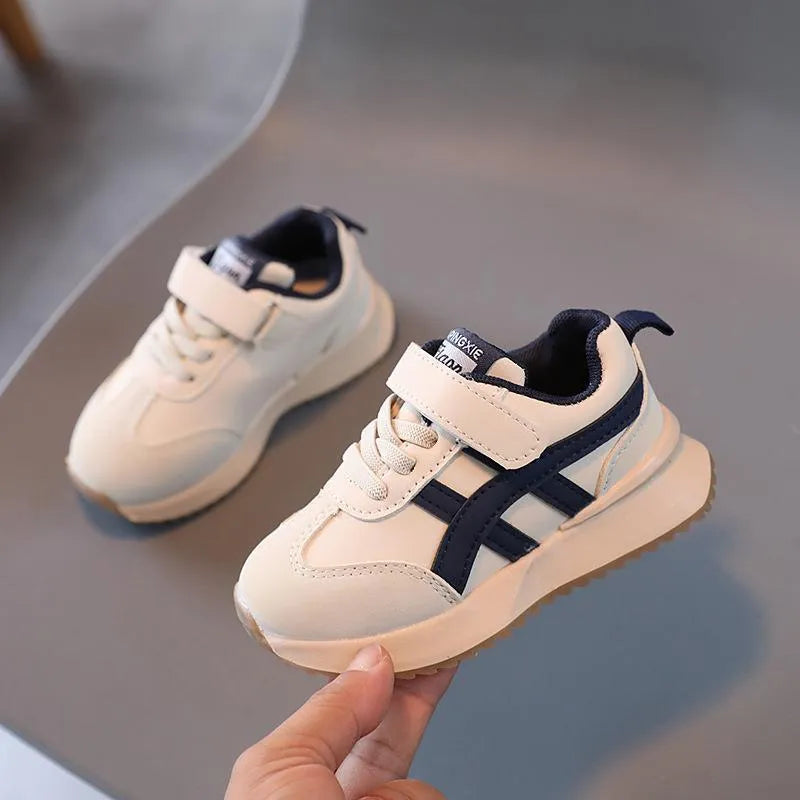 Children's white casual sneakers with Velcro fastening, synthetic leather upper, and rubber sole