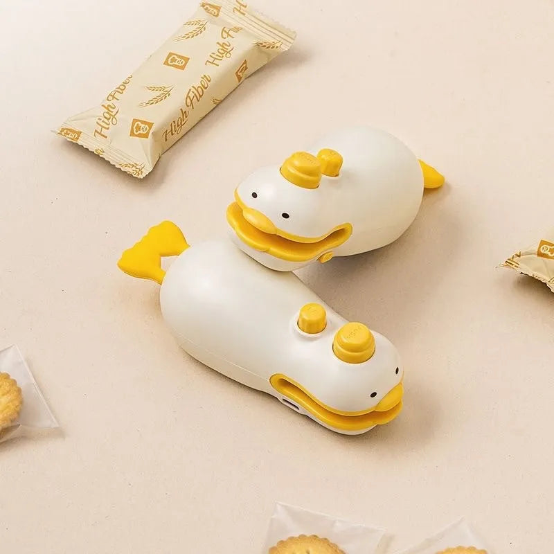 Yellow duck-shaped rechargeable handheld fabric sealing machine with charging cable
