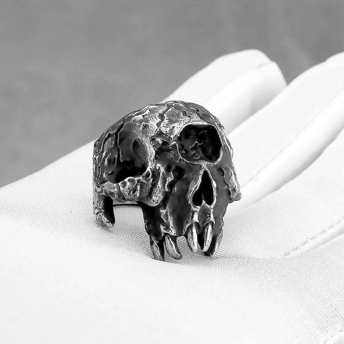 Retro punk alloy ring with a detailed one-eyed skull design and electroplated finish.