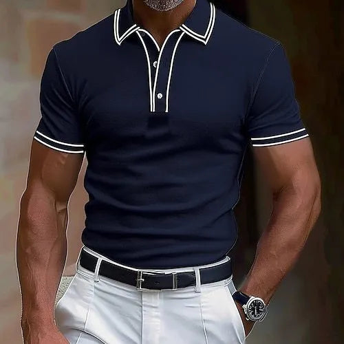 Man wearing a loose-fit striped short-sleeved t-shirt in a summer setting.