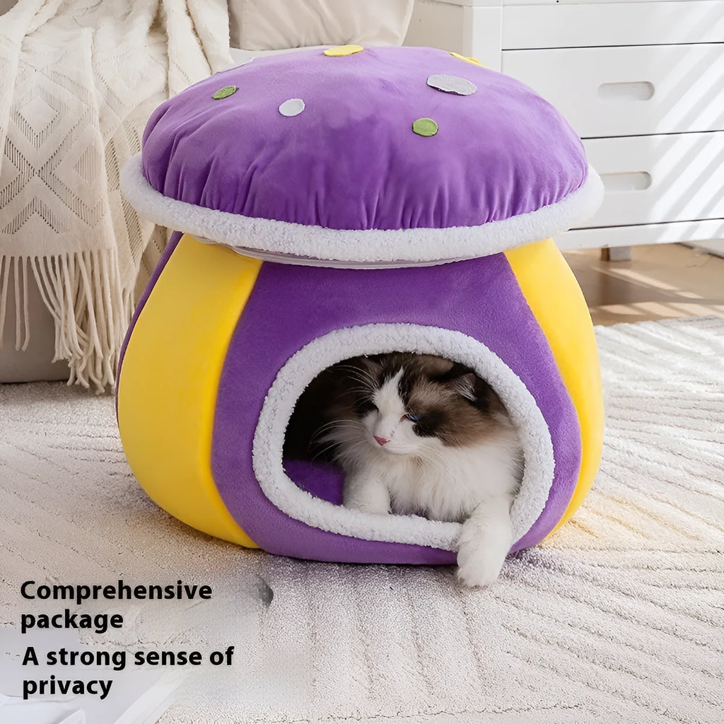 Grey mushroom-shaped plush cat bed with an entrance hole, shown on a wooden floor.