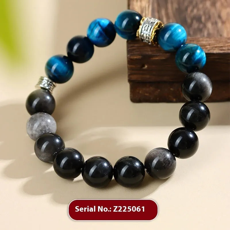Handmade geometric Peacock Blue Tigereye stone bracelet with round beads on a wrist.