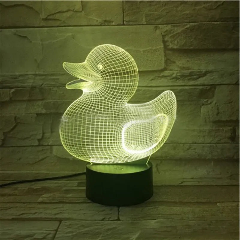 Little yellow duck 3D night light on table showing multiple colour options