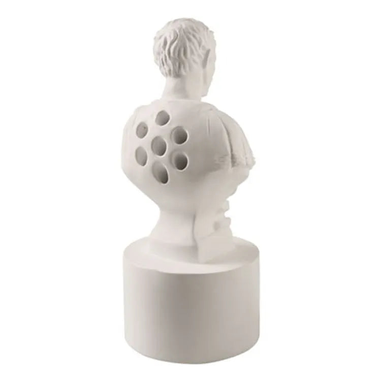 White synthetic resin pen holder designed as an American-style creative character model on a desk.