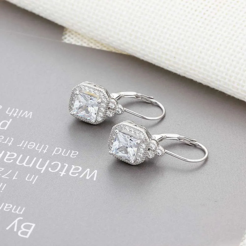 s925 sterling silver crown rhinestone earrings on a white background, polished silver finish with clear stones