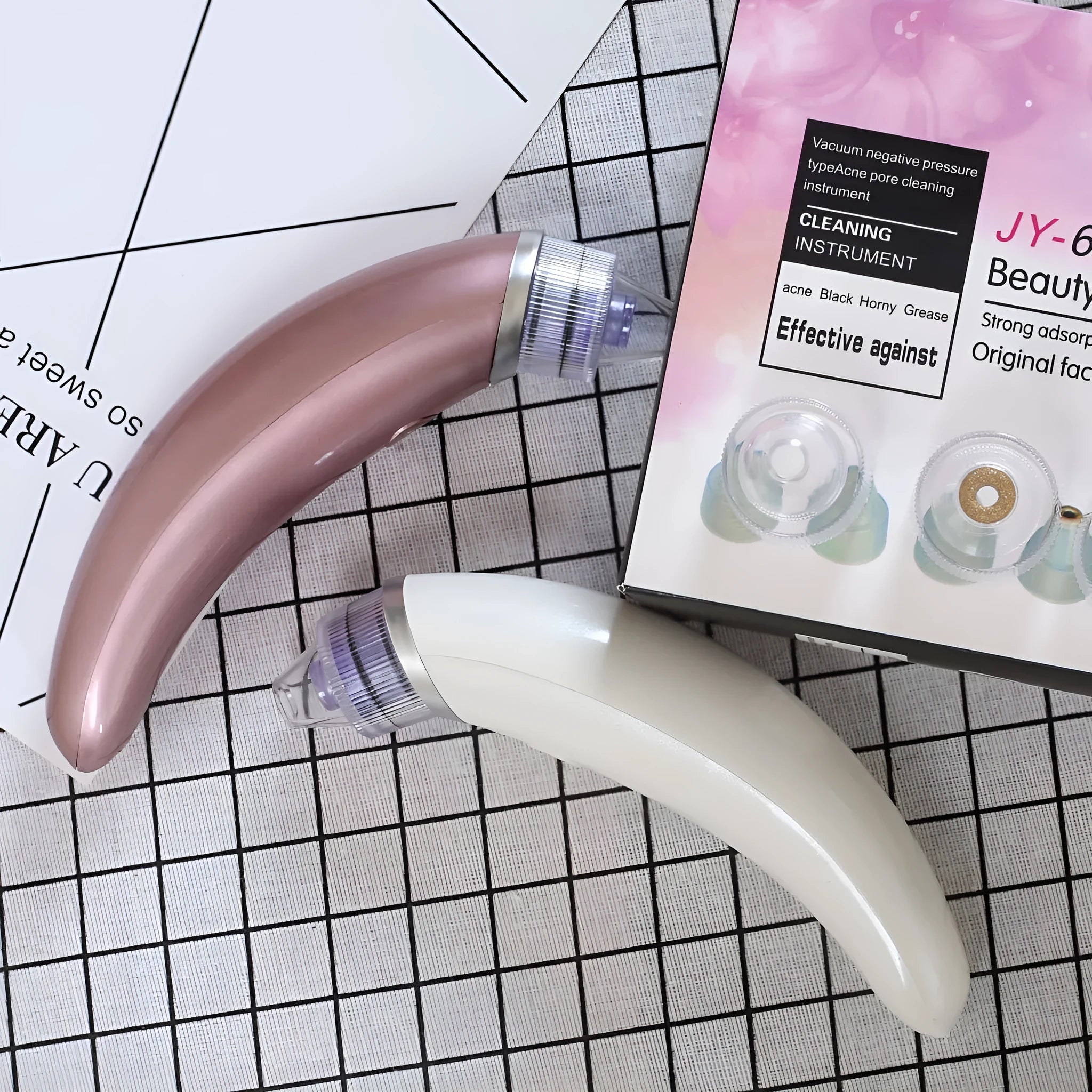 JY-666 electric blackhead suction instrument in rose gold or white finish for facial pore cleansing