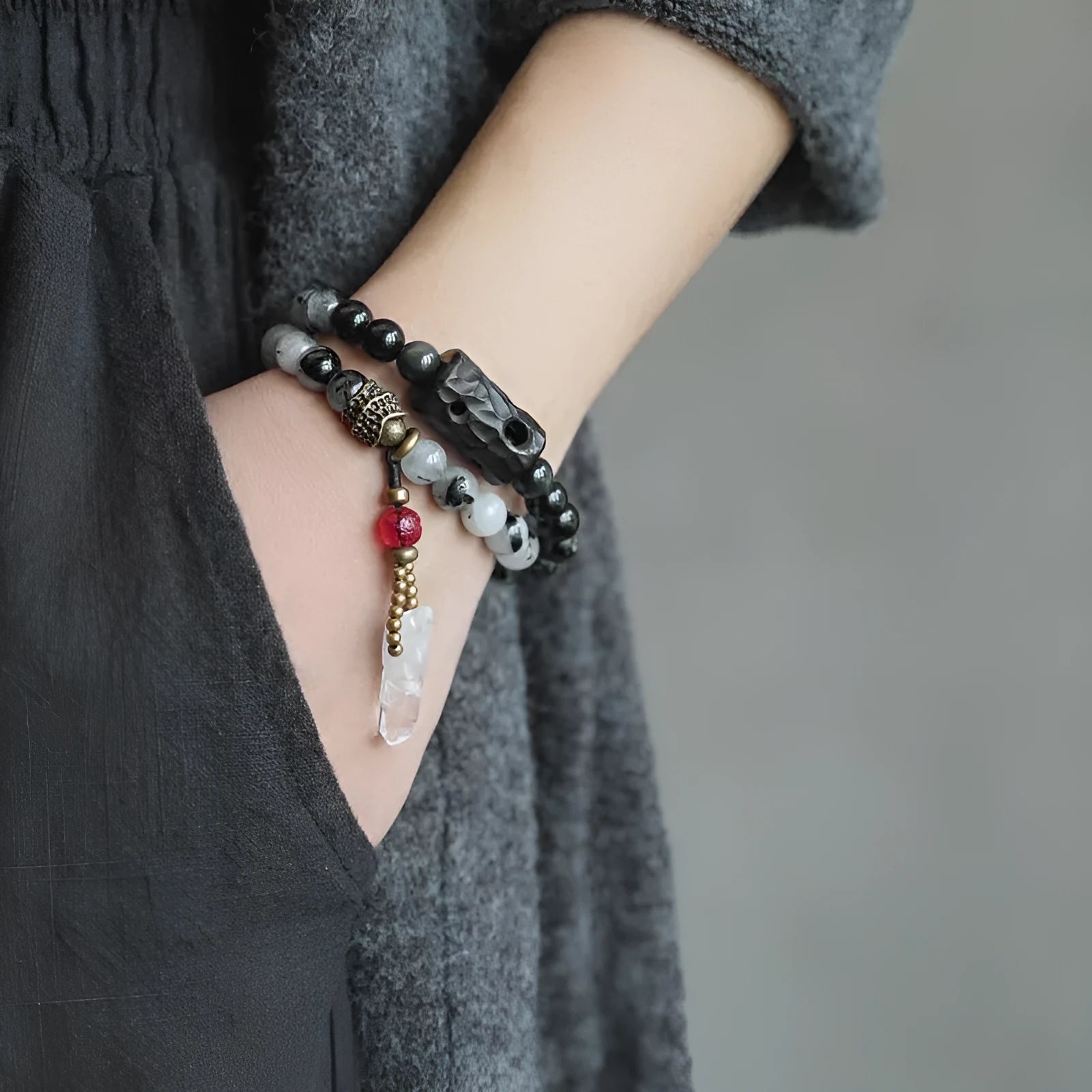 Ethnic black hair bracelet with white crystal tassel featuring bend and lace craftsmanship