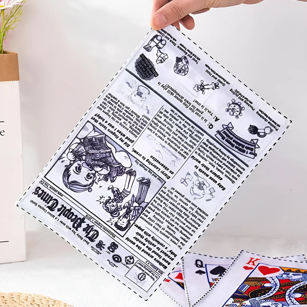 Tearproof rubber dog toy with playing card designs J, K, Q and newspaper motif with squeaking sound feature
