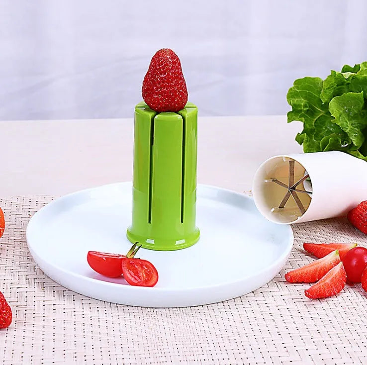 White kitchen vegetable fruit slicer with six stainless steel blades for cutting cucumbers carrots strawberries.