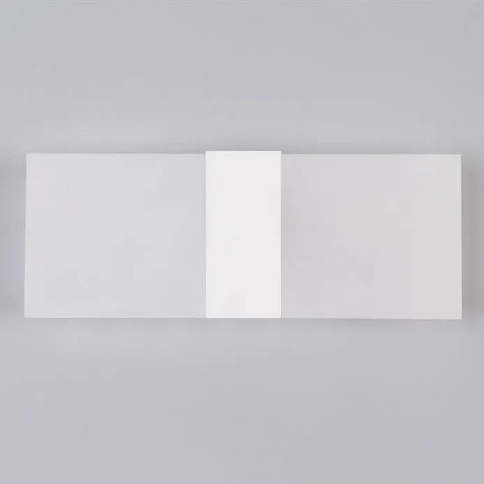 Black acrylic LED wall lamp with modern design mounted on wall