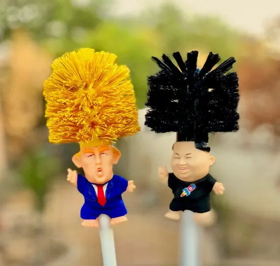 Yellow plastic Donald Trump novelty toilet brush with hanging slot.