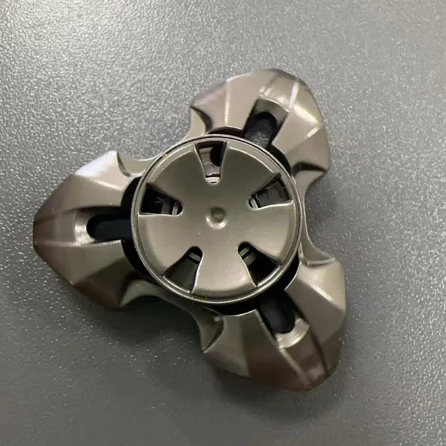 Alloy metal rotating fingertip gyro decompression toy in gun colour and colourful options.