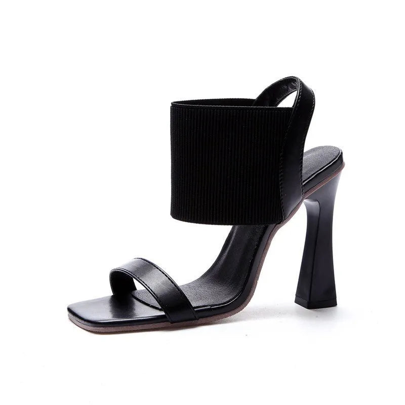 Women's black high heel sandals with elastic straps and rubber sole