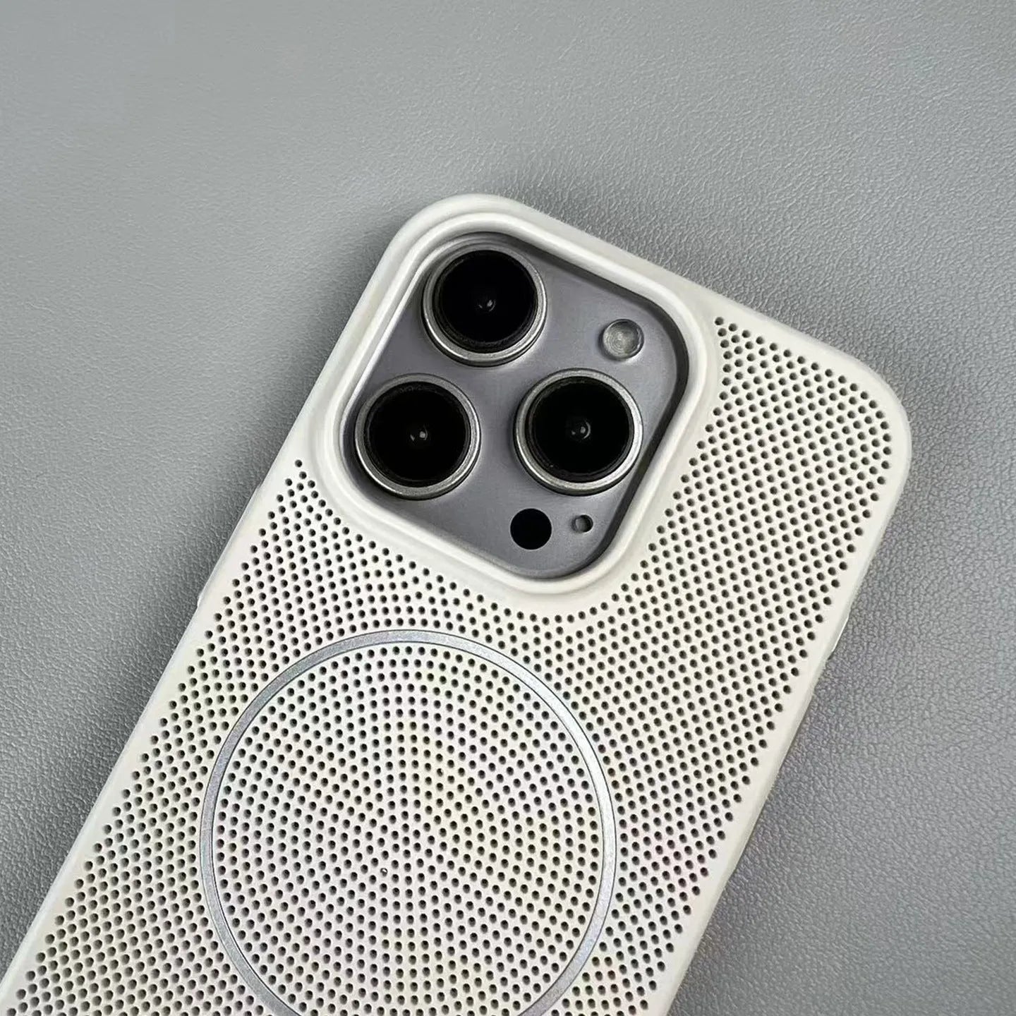 Frosted magnetic iPhone case in blue showing heat dissipation design and shockproof construction